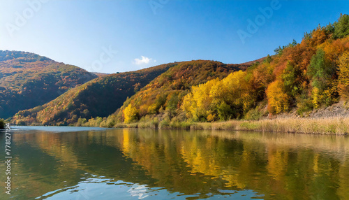 Beautiful landscape with autumn mountains and hills by the river