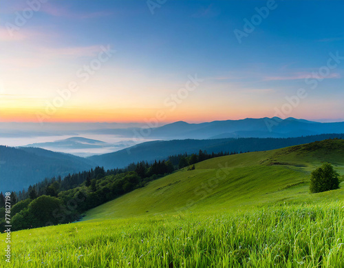 Beautiful landscape with green grass and hills in the morning