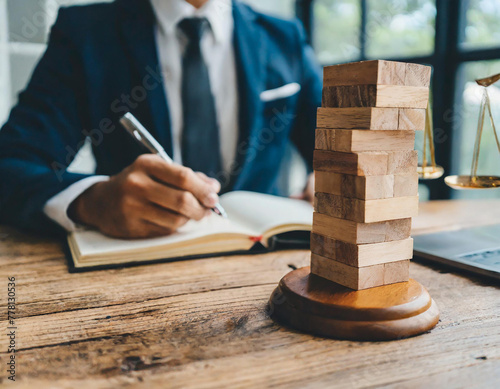 Legal consultant and lawyer concept. Businessman stacking wooden block with law law legal justice icon. Legal advice in Labor law for a business company legal