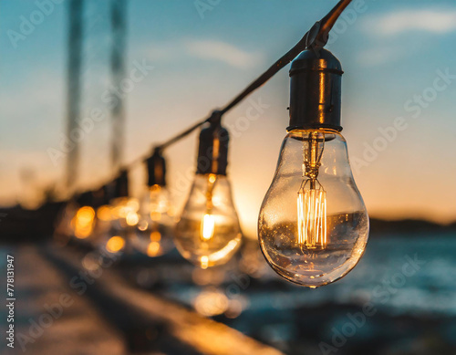 String Lights bulbs at Orange Sunset © Merlin