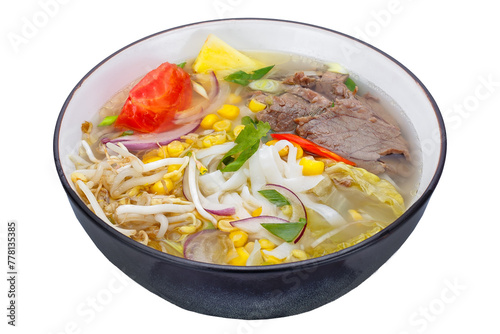 Thai style noodle soup with beef and vegetables isolated on white background