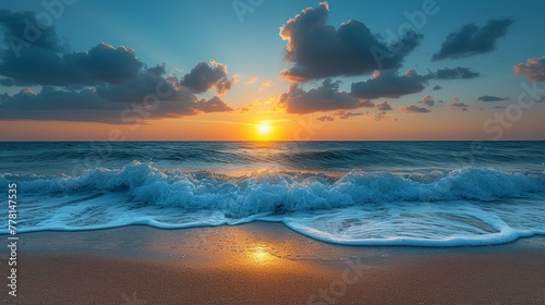 the sun is setting over the ocean and the waves are crashing in front of a beach with a few clouds.