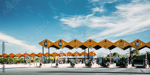Cars Passing Through The Automatic Point Of Payment On A Toll Road. Point Of Toll Highway, Toll Station. Highway Toll Plaza Or Turnpike Or Charging Point, Entrance On Motorway. photo