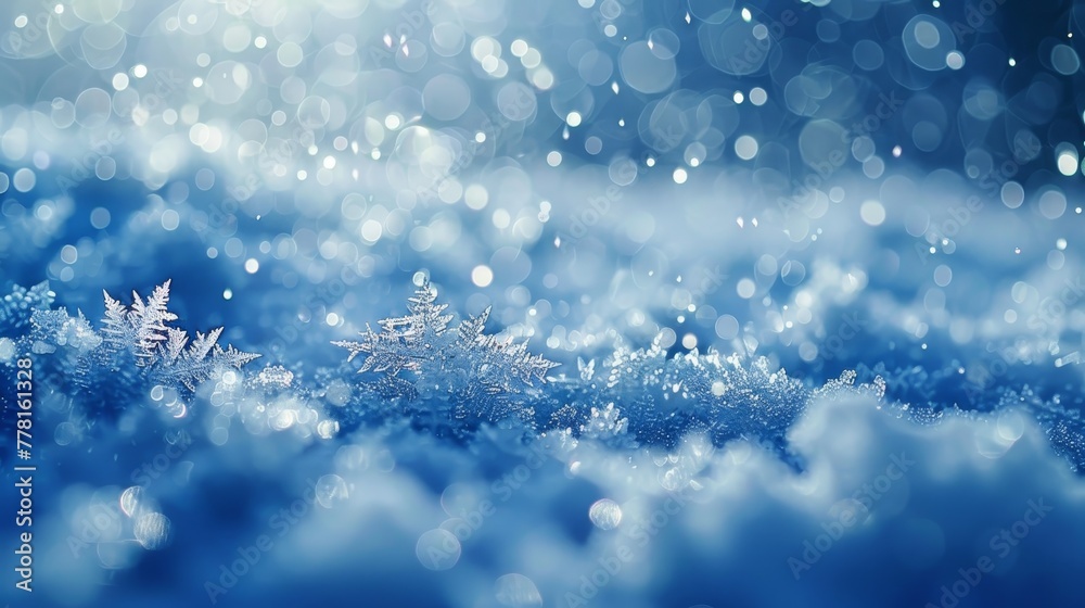 A snow covered landscape with a snowflake on the ground. The snow is falling and the sky is blue A snow covered landscape with a snowflake on the ground. The snow is falling and the sky is blue