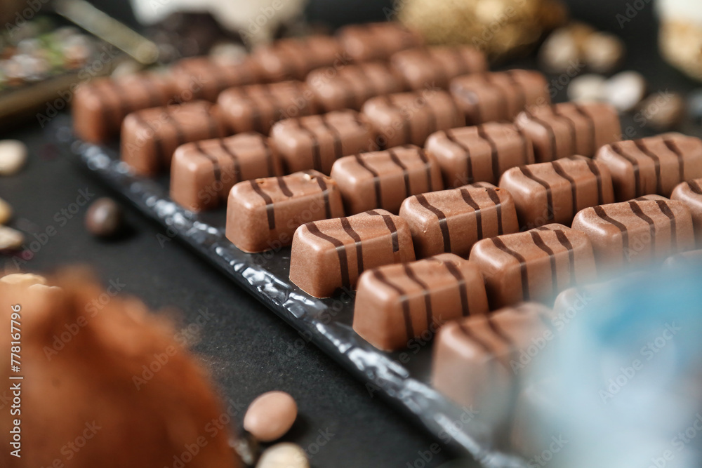 Assorted Chocolates and Nuts Covering a Table Assorted Chocolates and Nuts Covering a Table