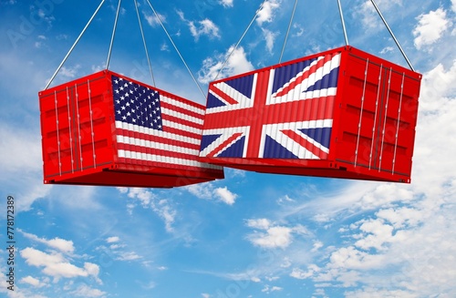 US of America and UK flags crashed containers on sky at cloudy background