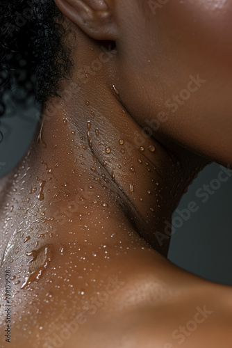 Black beauty model female woman body perfect glowing nourished hydrated wet shower skin care  close up detail.
