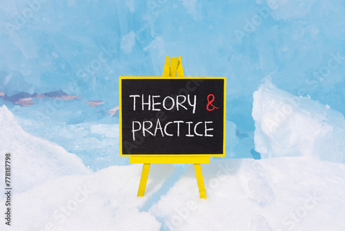 Theory and practice symbol. Concept words Theory and practice on beautiful yellow black blackboard. Beautiful blue ice background. Business theory and practice concept. Copy space.