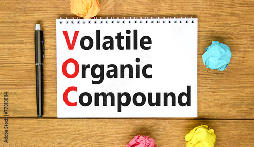 VOC volatile organic compound symbol. Concept words VOC volatile organic compound on beautiful white note. Beautiful wooden background. Business VOC volatile organic compound concept. Copy space. © Dzmitry