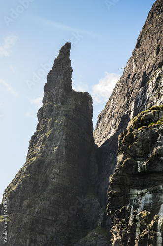 Dramatic cliffs Trollkonufingur, the witches finger, in Faroe Islands, Vagar island, Northern Europe, viewpoint photo