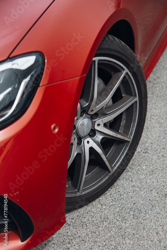Front wheel of modern car with a rims and tyre © Moose