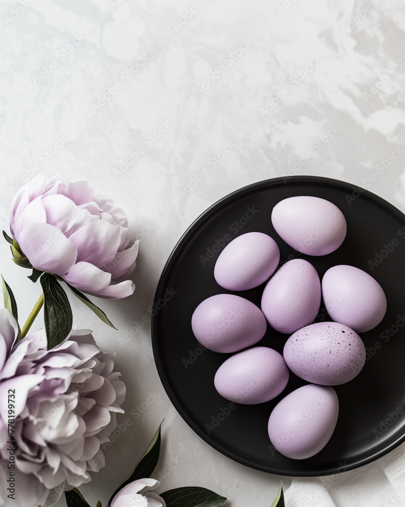 A photo of pink and purple Easter eggs on a black plate A photo of pink and purple Easter eggs on a black plate