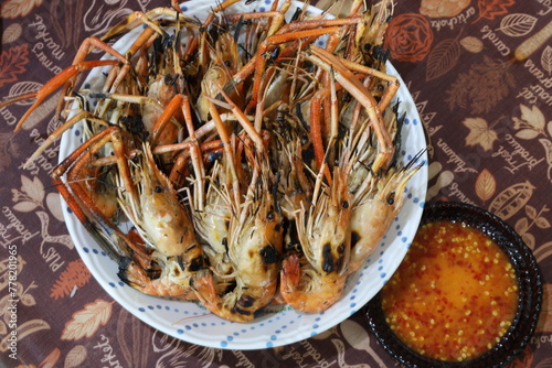 Lots of grilled shrimp served with dipping sauces.