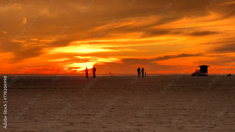 People enjoy tropical beach vacation during sunset People enjoy tropical beach vacation during sunset