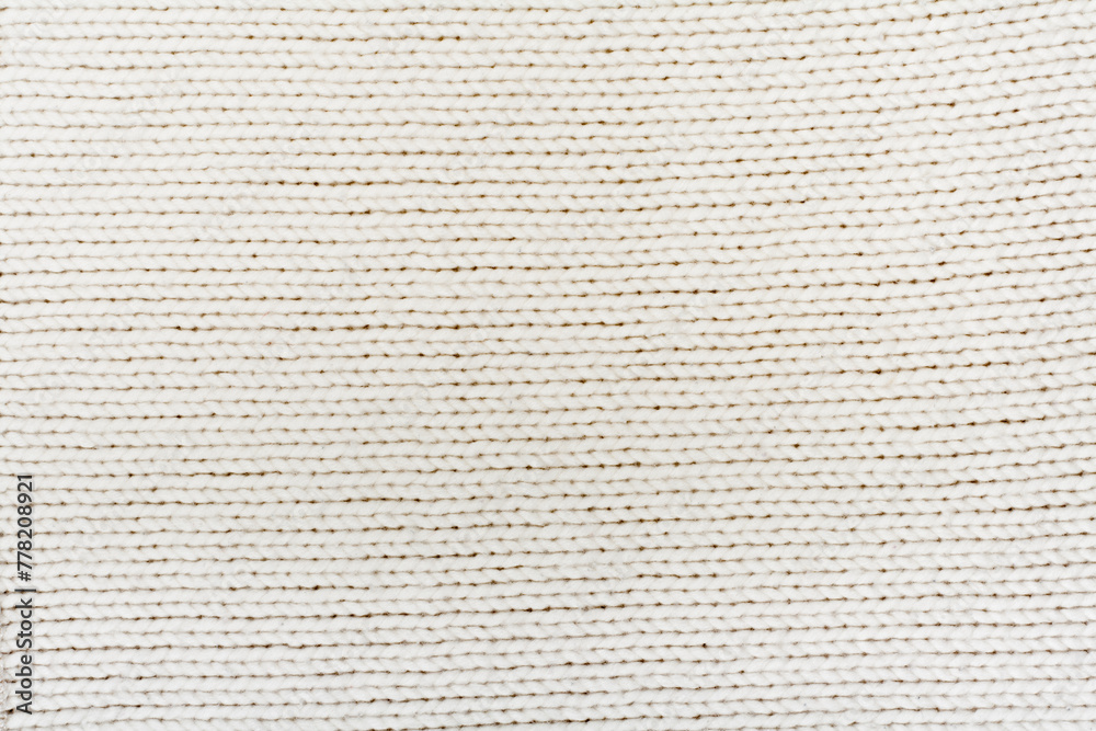 Sweater or scarf fabric texture large knitting. Knitted jersey background with a relief pattern. Wool hand- machine, handmade. Sweater or scarf fabric texture large knitting. Knitted jersey background with a relief pattern. Wool hand- machine, handmade.