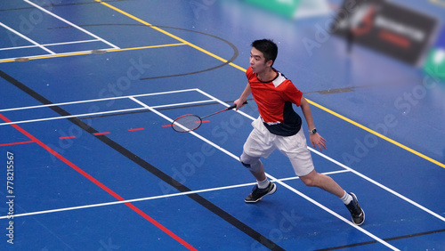 young man plays single badminton