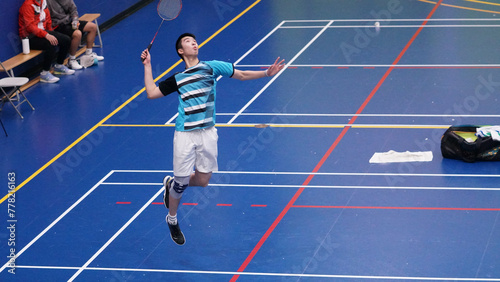 young man plays single badminton