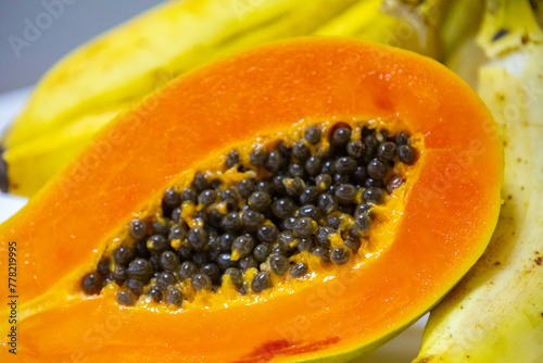 Beautiful cut ripe papaya showing seeds and ripe pulp