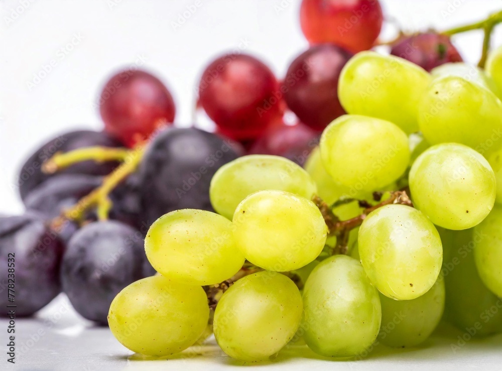 Green and red grapes isolated on white background closeup Green and red grapes isolated on white background closeup