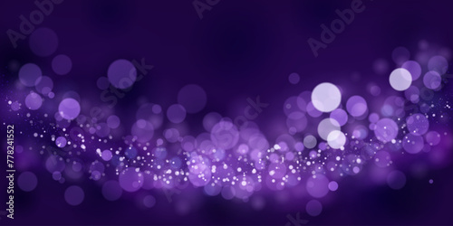 Abstract background in purple tones with many shiny sparkles, some of which are in focus and others are blurred, creating a captivating bokeh effect.