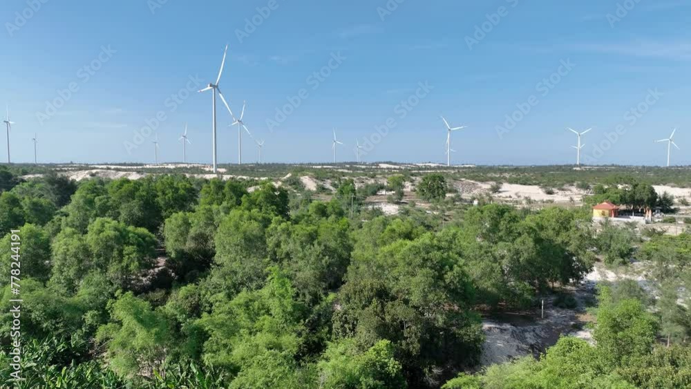 Aerial drone view of field landscape with wind power turbines in Quang Binh, Vietnam Aerial drone view of field landscape with wind power turbines in Quang Binh, Vietnam
