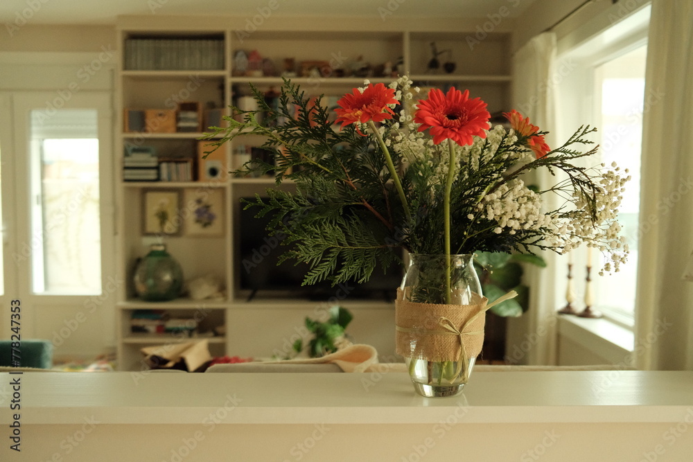 vase of flowers in the living room of a house
