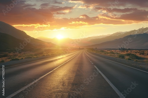 Scenic highway leads to a sunset-lit mountain range on an open road journey