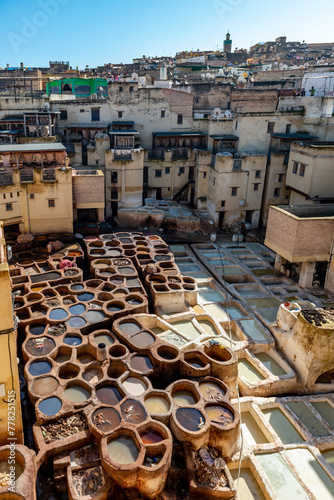 EZ, MOROCCO. Dec 05, 201The tannery in Fez. The tanning industry in the city is considered one of the main tourist attractions. The tanneries are packed with the round stone wells filled with dye