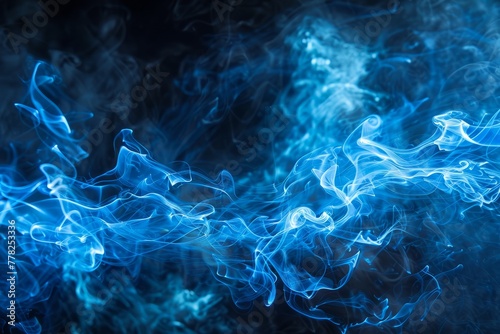 Blue smoke texture swirling and blending intensively against a stark black backdrop photo