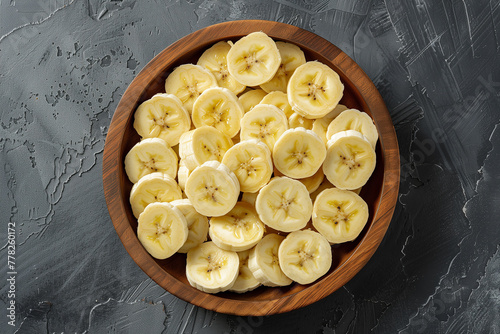 Top view circular sliced bananas. Fruit background. Generative AI. © pomiti