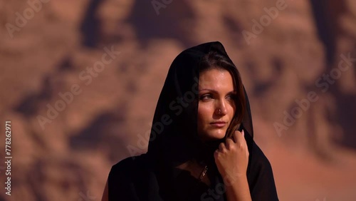 Traditional Young Woman Dancing In The Wadi Rum Desert, Jordan