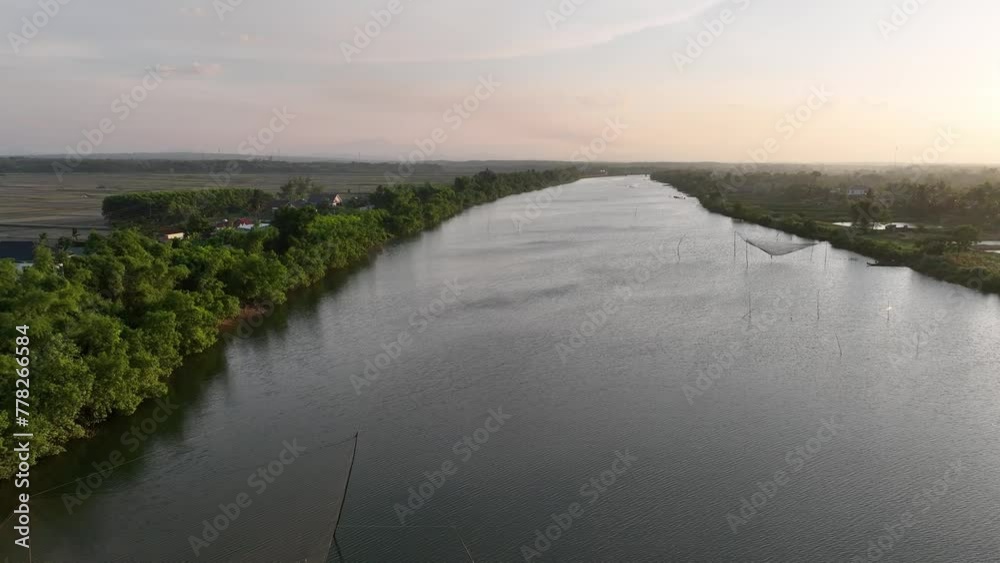 Serene aerial view of river with fishing net on a tranquil river in Quang Binh, Vietnam Serene aerial view of river with fishing net on a tranquil river in Quang Binh, Vietnam