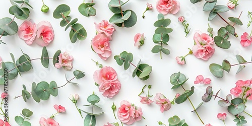 Delicate pink flowers with green pedicels on a light background photo
