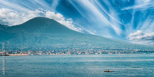 Naples, Italy. Man Training On Kayak In Tyrrhenian Sea. Landscape With Volcano Mount Vesuvius And Tyrrhenian Sea In Sunny Summer Day.