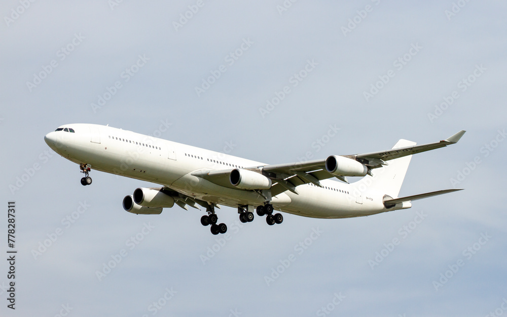 An Airbus A340 Airplane Landing At Tan Son Nhat International Airport, Vietnam. An Airbus A340 Airplane Landing At Tan Son Nhat International Airport, Vietnam.