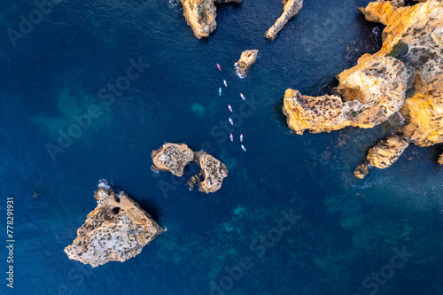 Sunrise over Ponta de Piedade, Algarve cliffs on coastline. Aerial drone view