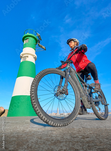 happy senior woman cycling ...