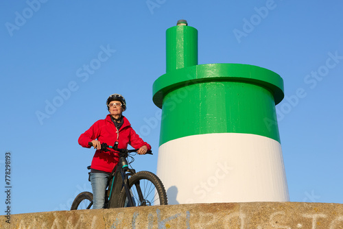 happy senior woman cycling ...
