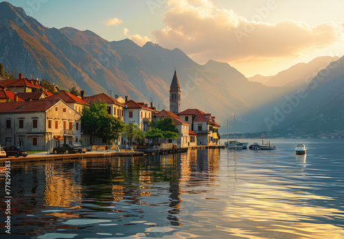 The picturesque town of Perast on the coast, with its historic buildings and colorful architecture, is set against the backdrop of majestic mountains during sunset