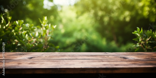 Banner with wooden table with green blurry nature background