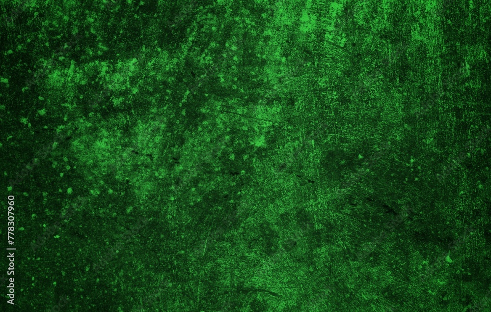 Fototapeta premium A textured green grunge background with dark patches and rough surface