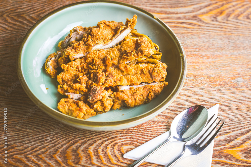 All time favourite chicken Cutlet with mala spice on top of fettucine All time favourite chicken Cutlet with mala spice on top of fettucine