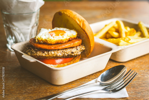 Champion Burger with Beef patty, chicken luncheon meet, sunny side up egg