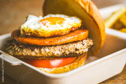 Champion Burger with Beef patty, chicken luncheon meet, sunny side up egg