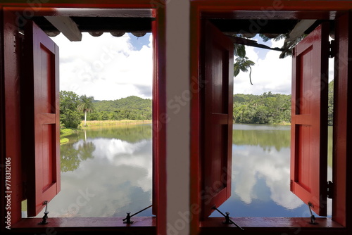 Window with a view in the bedroom of a local house overlooking Lago San Juan Lake in Las Terrazas tourist rural eco-community. Candelaria-Cuba-137