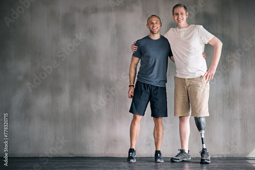 happy, physiotherapist and man with disability in portrait with prosthetic leg in mockup space. Studio, background and orthopedic healthcare or rehabilitation for disabled male person with smile © peopleimages.com