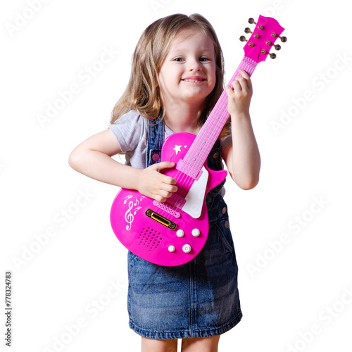 Little girl child in jeans dress looking smiling happiness with toy guitar on white background isolation