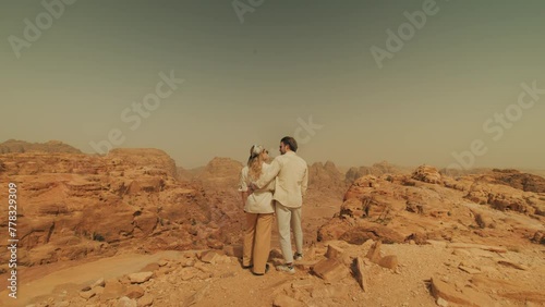 Tourists Travelling through Arabian Desert in Jordan and expressing love photo