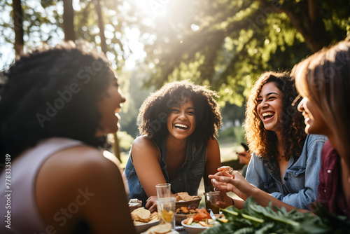 diverse group of people sitting in a park having fun. Group of People having fun iin the Park, diverse group of people sitting in the park having fun having a picknick © MrJeans