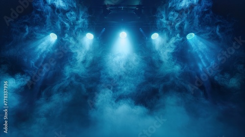 Blue stage lights cutting through smoke at a concert